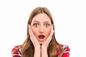 Portrait of surprised girl with raised eyebrows