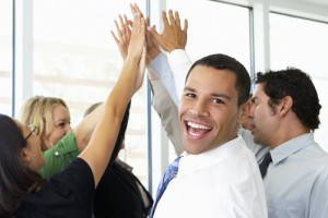 Business Team Giving One Another High Five