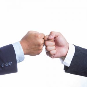 Two Businessman touching hand for coordination work